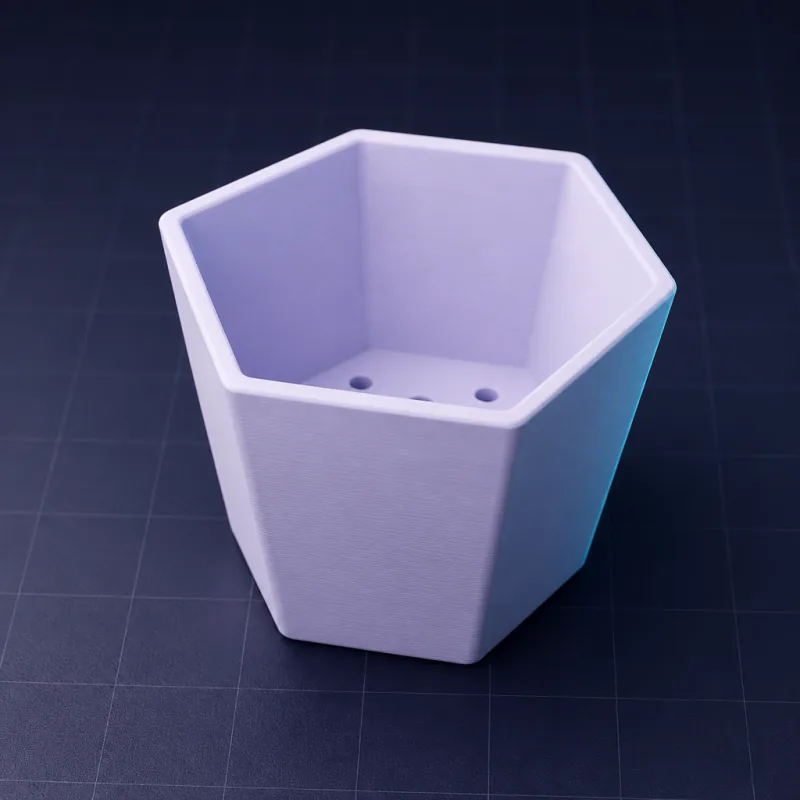 Hexagonal planter with drainage, generated with SpeakCAD